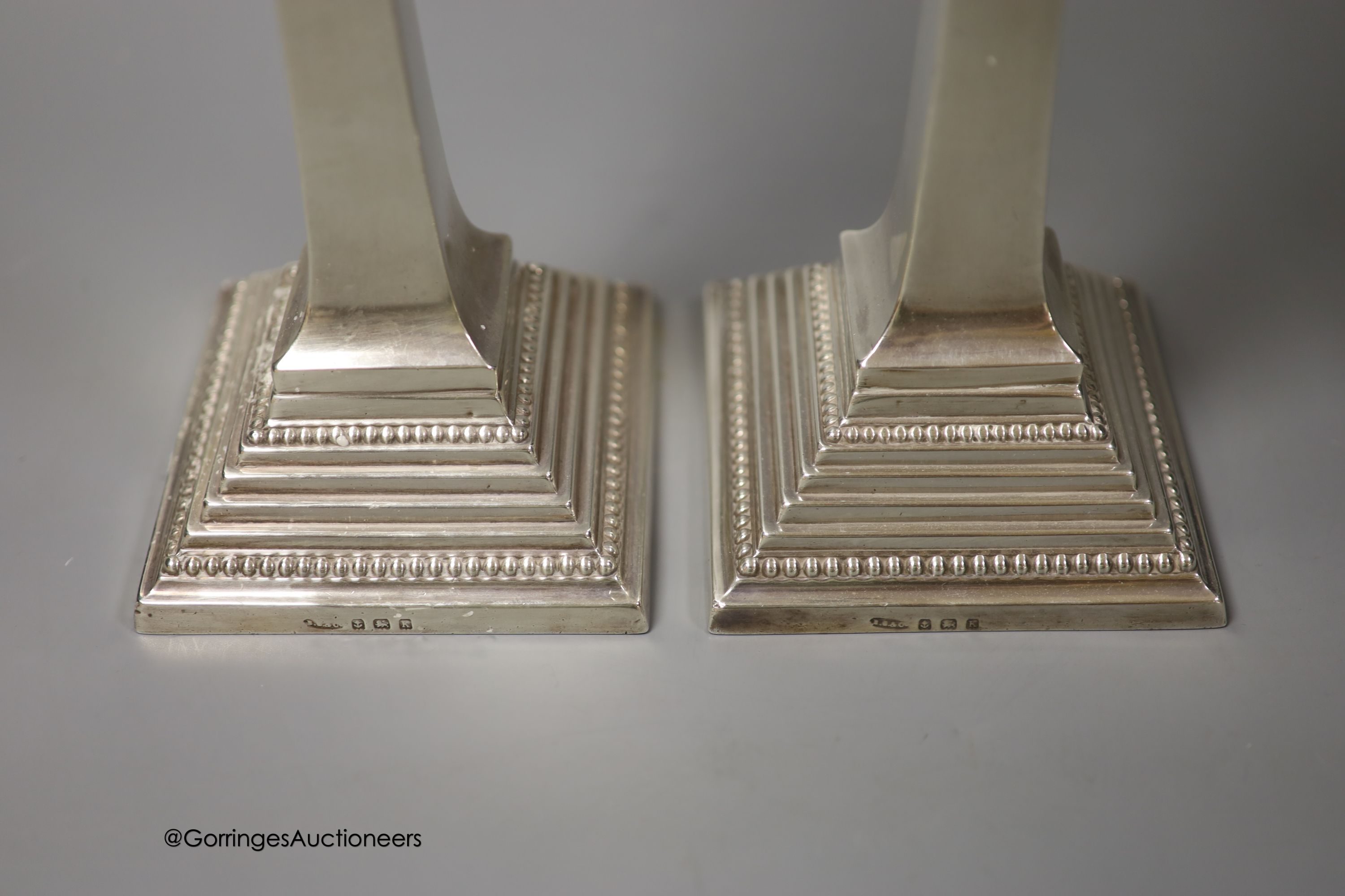 A pair of George V silver candlesticks, Britton, Gould & Co, Birmingham, 1934, 28.4cm, 20.5 oz, lacking sconces.